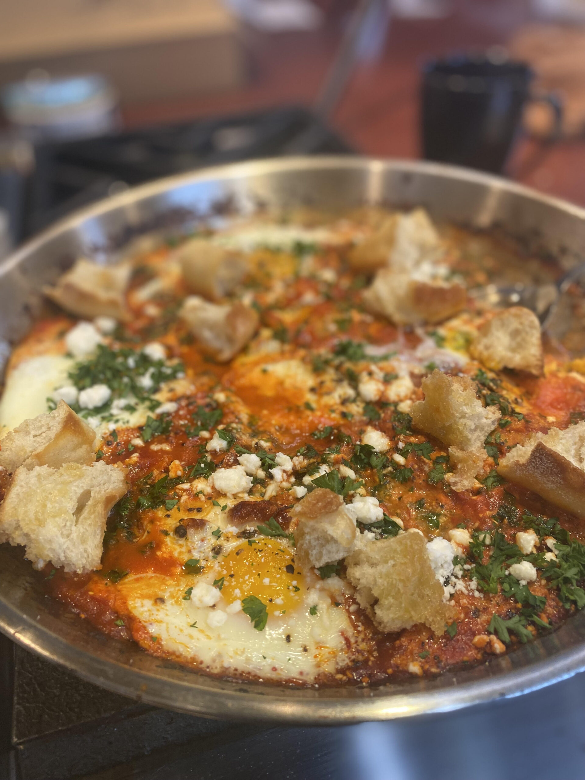 Shakshuka with Swiss Chard, Feta & Rustic French Bread by Chef Kai Chase